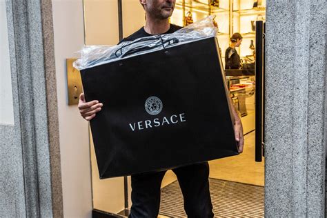 michael kors buys versace for $2.12 billion|which brands do versace own.